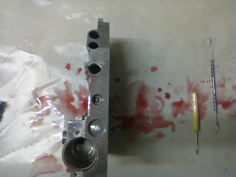 Regulator valve and solenoid switch valve locked into their bores